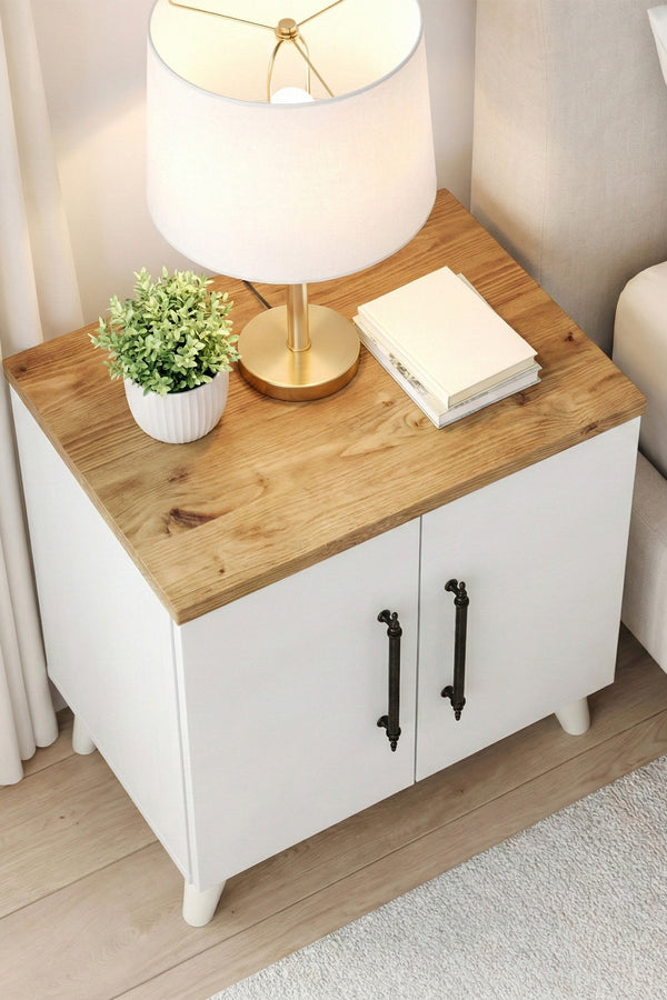 White and pine Lumen bedside table styled with a lamp and books