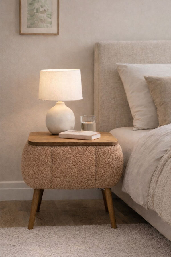 Angled view of the brown Lina upholstered bedside table showing tapered wooden legs - Sohowells