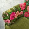 Close up of hand embroidered floral detail on olive velvet armchair - Sohowells