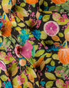 Side profile of citrus fruit patterned button back occasional chair