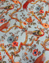 Close up of chinoiserie style bird and blossom print cotton upholstery on accent armchair