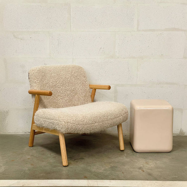 Beige fabric armchair shown in a room setting with curved armrests - Sohowells