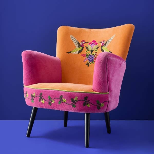 Orange and pink embroidered velvet armchair shown from an alternative angle - Sohowells