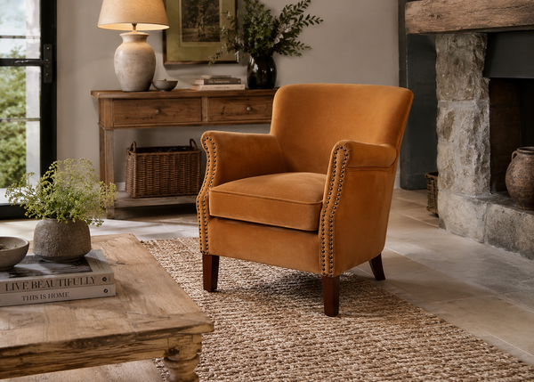 Cromarty armchair in brushed gold velvet with rolled arms and contrast stud detailing - Sohowells