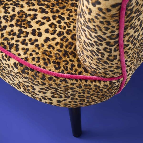 Animal print velvet armchair showing tall square back and black legs - Sohowells
