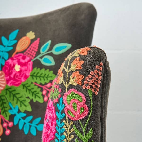 Close up of hand embroidered floral detail on charcoal velvet armchair - Sohowells