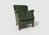 Green velvet Cromarty armchair showing curved padded back - Sohowells