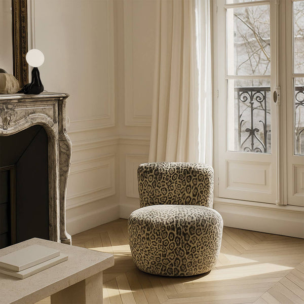 Leopard print faux fur accent chair shown in a room setting - Sohowells