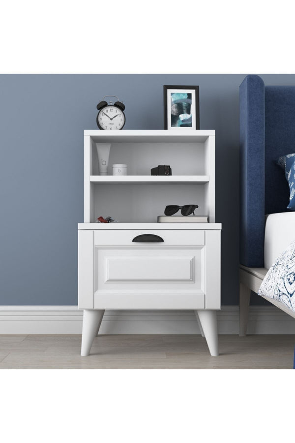 White bedside table shown in a bedroom setting - Sohowells