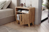 Angled view of Kommen light pine bedside cabinet showing raised legs - Sohowells