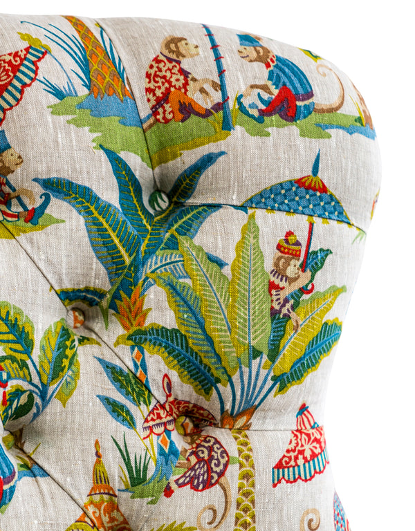 Close up of exotic monkey and palm foliage print upholstery fabric