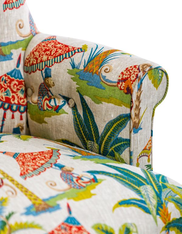 Detail of hand worked deep buttoning on monkey print occasional chair back
