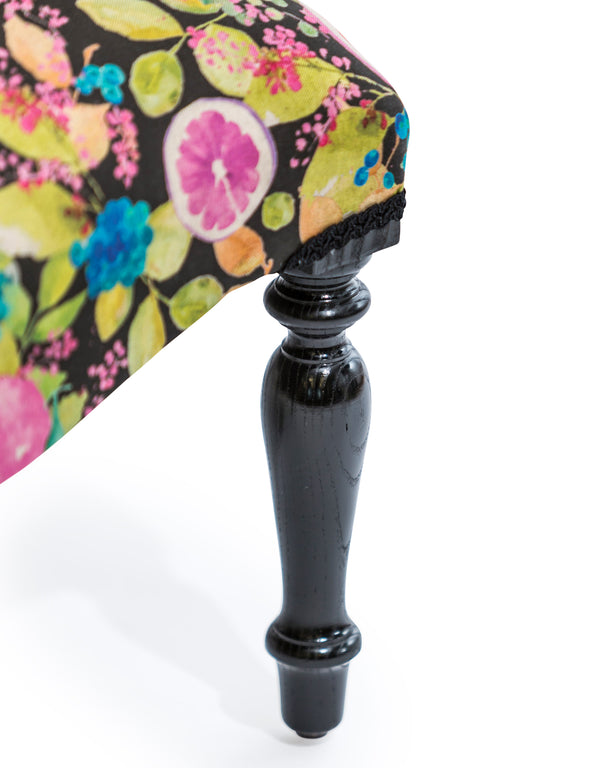 Detail of hand worked deep buttoning on citrus fruit occasional chair back