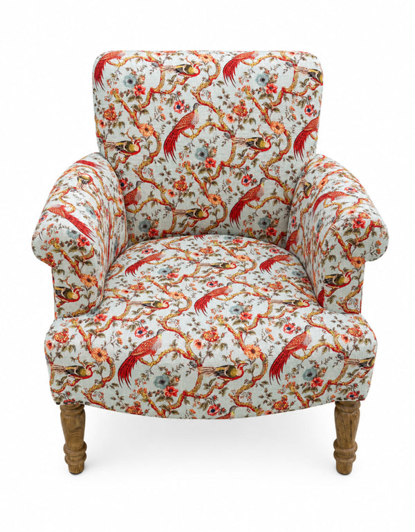 Side profile of oriental bird print occasional armchair showing mango wood arms and legs
