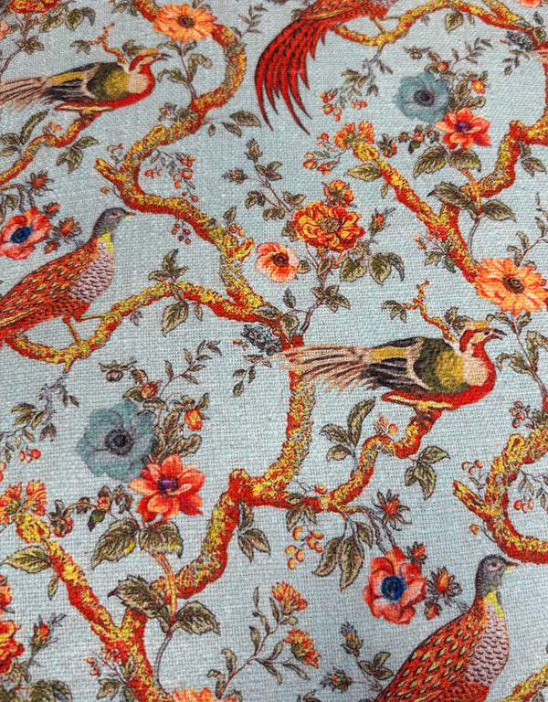 Close up of chinoiserie style bird and blossom print cotton upholstery on accent armchair