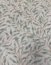 Close up of green William Morris willow leaf print cotton upholstery on occasional armchair