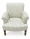 Side profile of green Willow Boughs patterned armchair showing mango wood arms and upright back