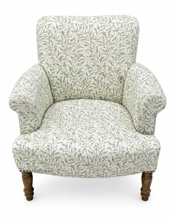 Side profile of green Willow Boughs patterned armchair showing mango wood arms and upright back