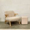 Beige fabric armchair shown in a room setting with curved armrests - Sohowells