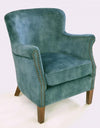 Mottled teal velvet studded armchair in a room setting - Sohowells