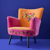 Orange and pink embroidered velvet armchair shown from an alternative angle - Sohowells
