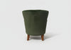 Forest green velvet studded armchair in a room setting - Sohowells