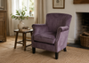 Cromarty armchair in smoky charcoal velvet with rolled arms and contrast stud detailing - Sohowells