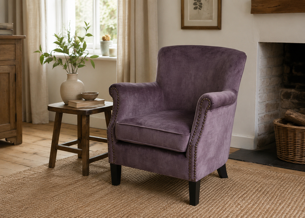 Cromarty armchair in smoky charcoal velvet with rolled arms and contrast stud detailing - Sohowells