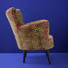 Leopard print statement armchair in a room setting - Sohowells