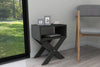 Anthracite X-leg bedside table shown in a bedroom setting - Sohowells
