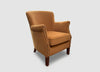Gold velvet Cromarty armchair showing curved padded back and studded arms - Sohowells